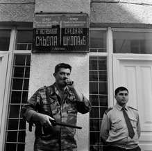 Armed parents guarded School No. 6 as school term restarted in Beslan, North Ossetia, September 2004